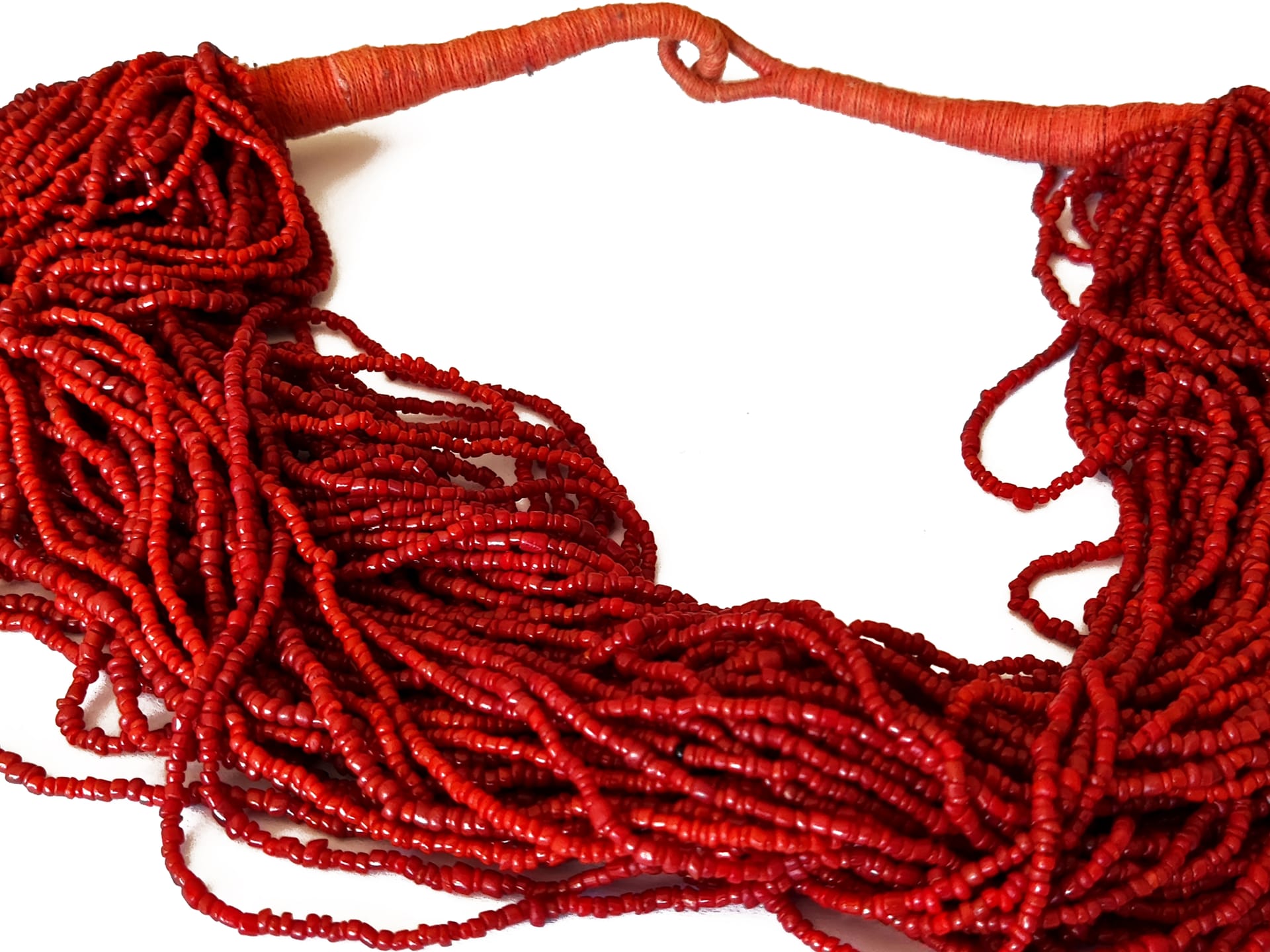 Multi-strand African necklace made from small red-coral beads.